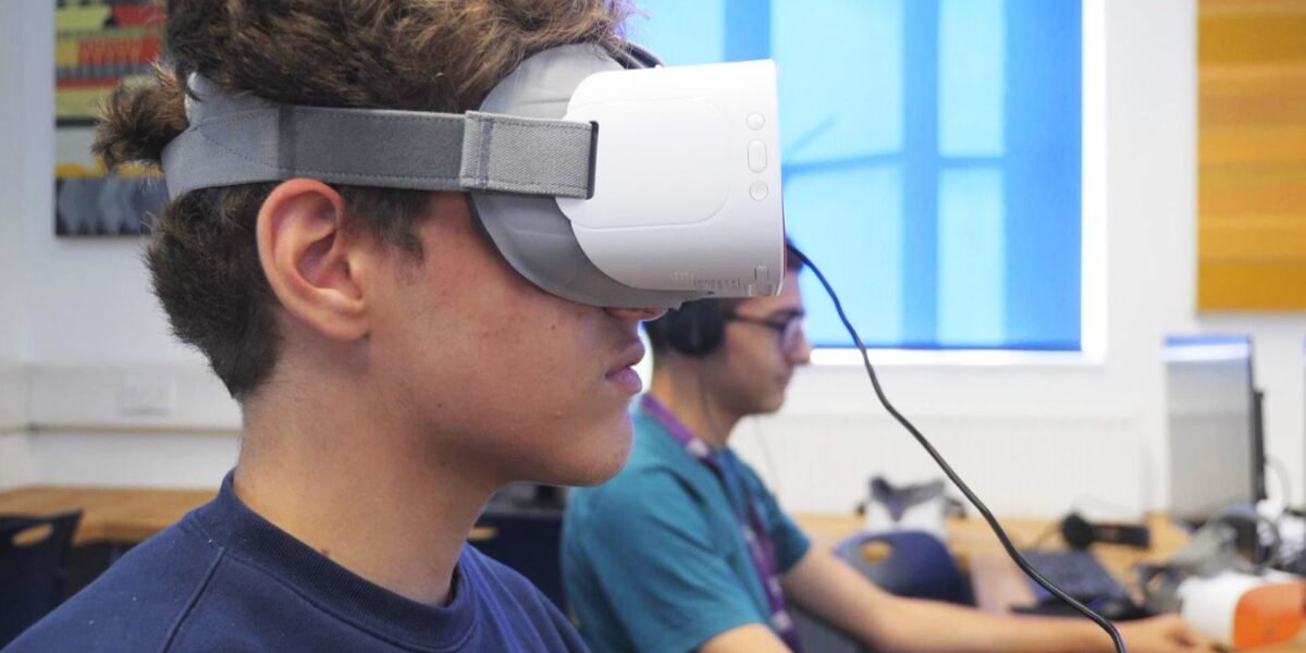 image of school children wearing VR headset, seating in educational lab