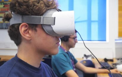 image of school children wearing VR headset, seating in educational lab